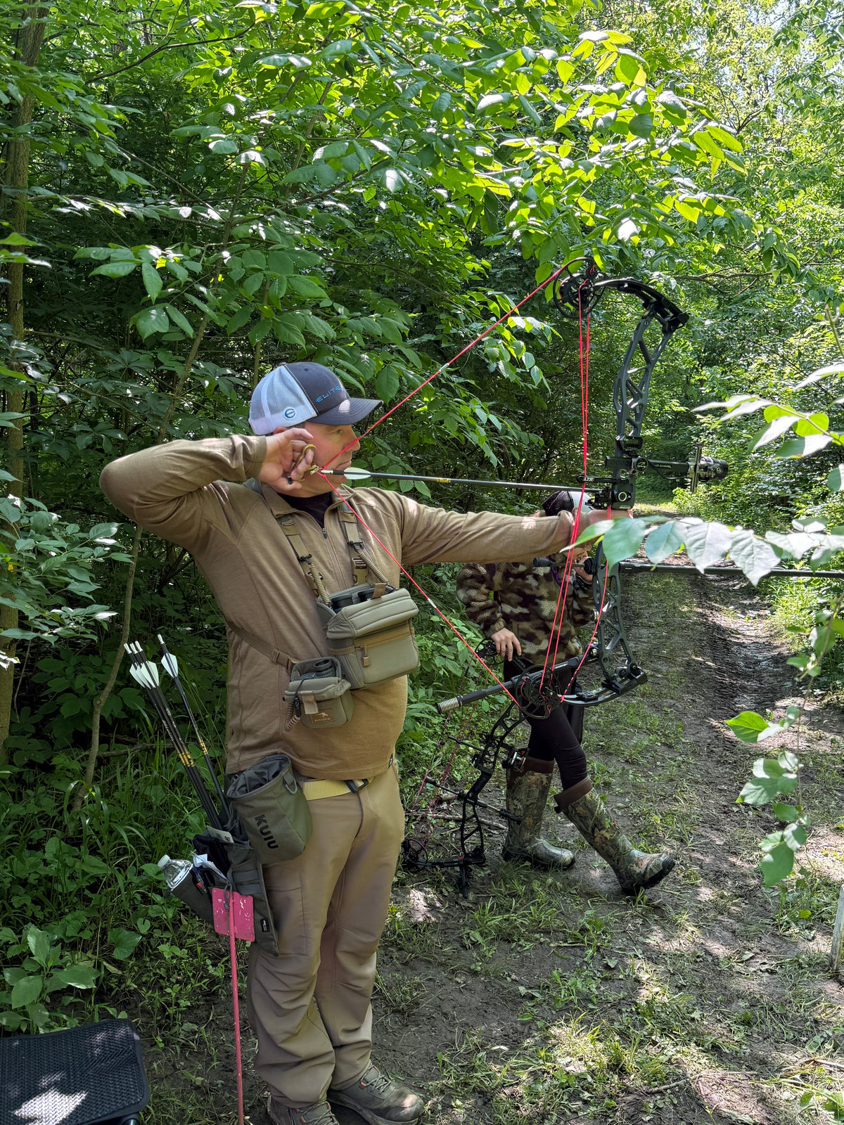 Archers shooting on a wooded 3D trail